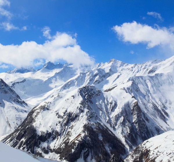 Snowy mountains in Alps of France. Galibier-Thabor skiing station in Valmeinier and Valloire. Massif des Cerces mountain range in Savoie Department of Rhone-Alpes region.